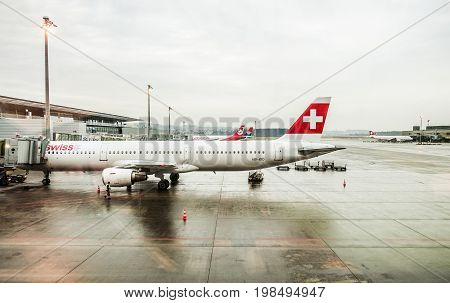 ZURICH - July 30: A-340 leaving Zurich airport for intercontinental flight on July 2017 in Zurich Switzerland. Zurich airport is home port for Swiss Air - Focus on airplane