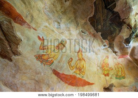 SIGIRIYA, SRI LANKA - MAY 20, 2011: Exterior of the ancient paintings at Sigiriya rock in Sigiriya, Sri Lanka. Sigiriya is a UNESCO World Heritage Site.