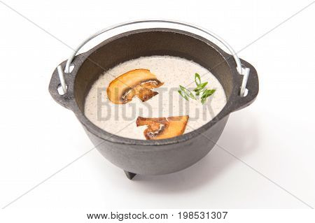 Mushroom Soup In Brutal Rustic Black Metal Pot On White