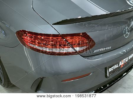Sankt-Petersburg Russia July 21 2017: Back view of a Mercedes Benz C 63s coupe 2017. Headlight. dark Matt colour .Car exterior details. Photo Taken at Royal Auto Show July 21