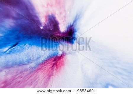 Abstract artistic background of colorful splash in motion. Watercolor gradient of dark blue to light purple