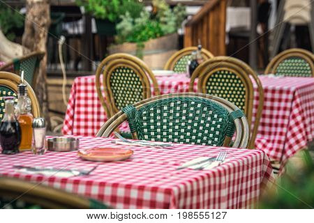 Itailan style restaurant with square tablecloths at Tel Aviv, Israel.
