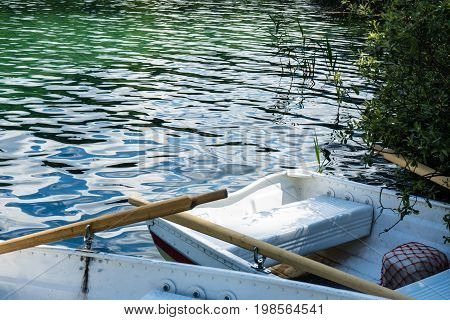 boats on crestasee lake ready to use in flims switzerland