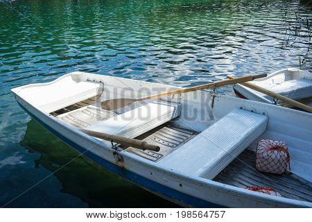 boats on crestasee lake ready to use in flims switzerland