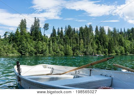 boats on crestasee lake ready to use in flims switzerland
