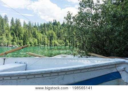 boats on crestasee lake ready to use in flims switzerland