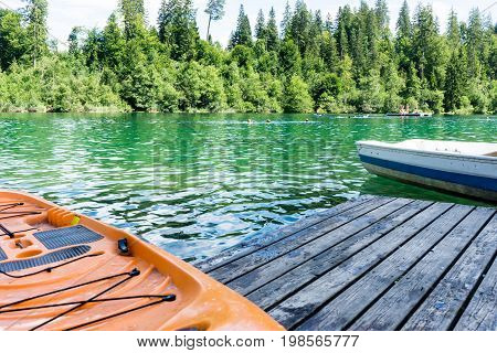 boats on crestasee lake ready to use in flims switzerland