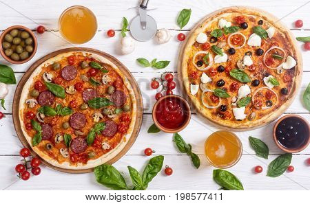 Italian pizza and ingridiend fod baking on table . Top view