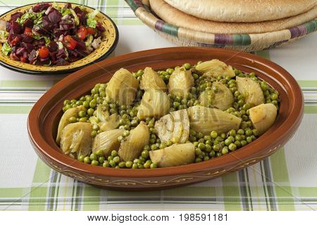 Traditional Moroccan tagine with meat, peas, fennel , beet salad and bread