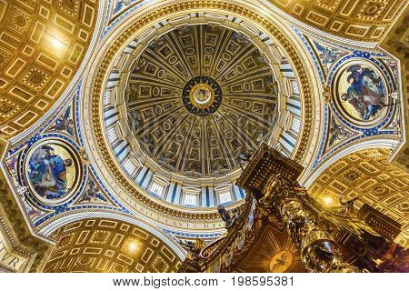 ROME, ITALY - JANUARY 18, 2017 Michelangelo Dome Baldacchino; Altar Saint Peter's Basilica Vatican Rome Italy. Dome built in 1600s over altar and St. Peter's tomb