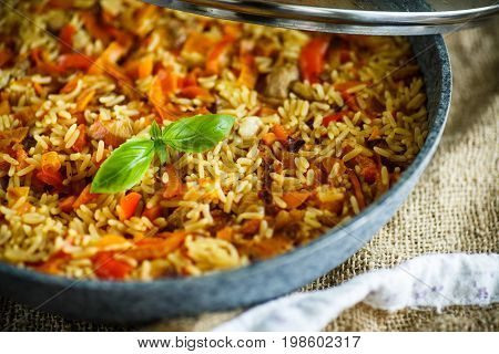 Pilaf with beef, carrots, onions, garlic, pepper and cumin. A traditional dish of Asian cuisine.