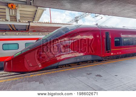 Modern high-speed passenger train stand on the railways station.