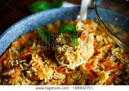 Pilaf with beef, carrots, onions, garlic, pepper and cumin. A traditional dish of Asian cuisine.