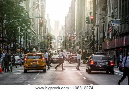 Lexington Crowdy Avenue In Manhattan At Around 5Pm On A Red Light Intersection. 5Pm With Sunset In T