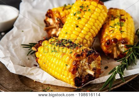 Corn Grilled With Salt And Spices. Dark Background. Fast Food In