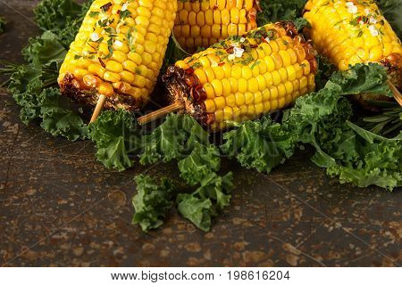 Corn Grilled With Salt And Spices. Dark Background. Fast Food In
