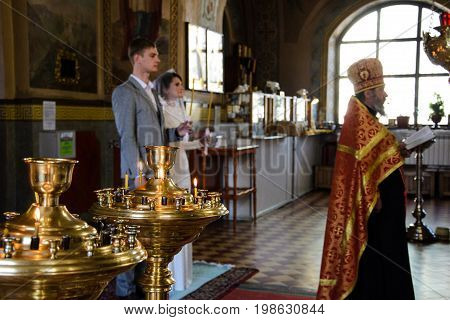 Alchevsk, Ukraine - April 28, 2017: Wedding Ceremony For Newlyweds In The Church