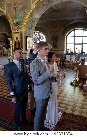Alchevsk, Ukraine - April 28, 2017: Wedding Ceremony For Newlyweds In The Church
