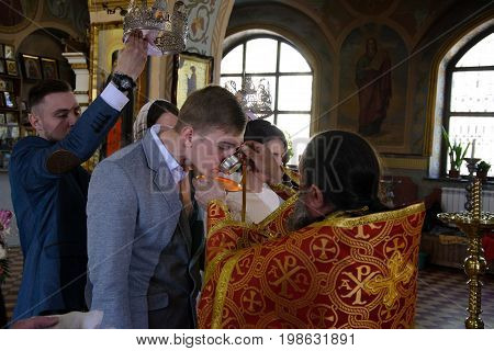 Alchevsk, Ukraine - April 28, 2017: Wedding Ceremony For Newlyweds In The Church