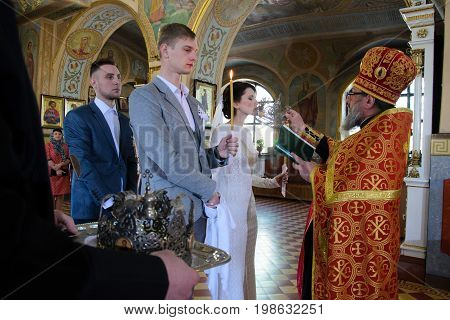 Alchevsk, Ukraine - April 28, 2017: Wedding Ceremony For Newlyweds In The Church