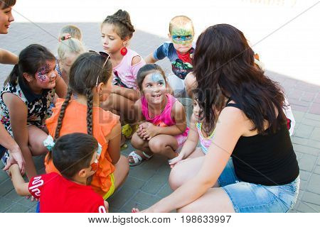 Alchevsk, Ukraine - July 27, 2017: Happy Children Play With Animators In Summer