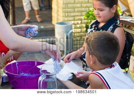 Alchevsk, Ukraine - July 27, 2017: Happy Children Play With Animators In Summer