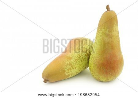 two fresh abate pears on a white background