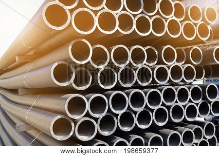 Plastic pipes in stock of finished products stacked in packs