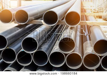Plastic pipes in stock of finished products stacked in packs