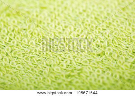 Green cotton fabric texture background. Makro shot.