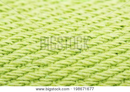 Green cotton fabric texture background. Makro shot.