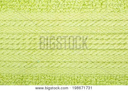 Green cotton fabric texture background. Makro shot.