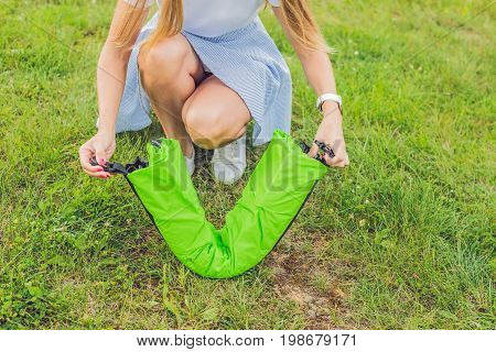 A Woman Tries To Inflate An Air Sofa