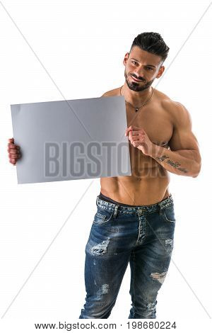 Naked young male bodybuilder holding blank white sign, isolated on white background, large copyspace