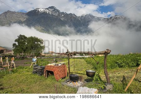 Gergeti, Georgia - 2017 June 16: outdoor Cafe in the high mountain village Gergeti, Georgia, Cafes, which serve national georgian food and you can buy paintings of local artists