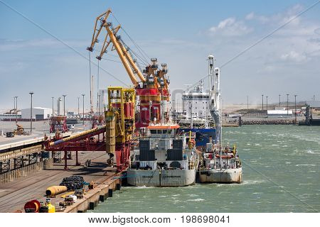 HARBOR CALAIS FRANCE - JUNE 07 2017: Carriers moored for loading and unloading in harbor of Calais France