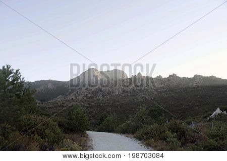 View of La Maliciosa on the way up to the Majalaespino reservoir in summer. Monte de Los Almorchones in the Community of Madrid. Spain.