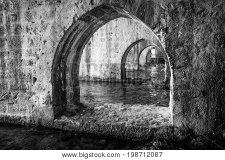 The interior of the shipyard (Tersane) in the ruins of a medieval fortress (Alanya Castle). Alanya. Turkey. Black and white.