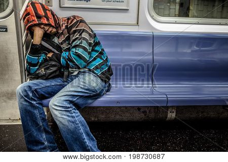 Man Sleeping In The Subway In Manhattan At Around 2Am During The Night