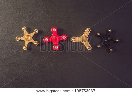 Famous Fidget Spinner Stress Relieving N A Black Wooden Background