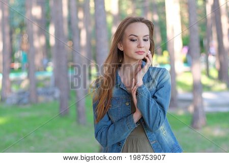 Beautiful woman in the park. Outdoor portrait