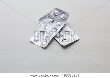 Used Packs Of Pills On Medical Table