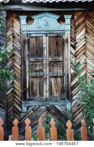 Old wooden window. Russian weekend in a village.