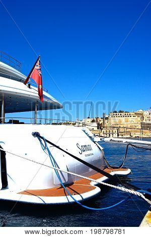 VITTORIOSA, MALTA - MARCH 31, 2017 - Luxury yacht moored in the marina with views towards Valletta waterfront Vittoriosa Malta Europe, March 31, 2017.