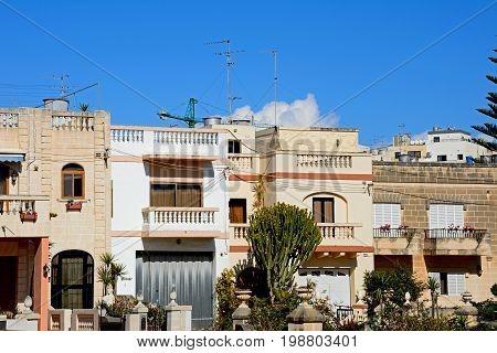 BUGIBBA, MALTA - MARCH 28, 2017 - Row of traditional Maltese townhouses Bugibba Malta Europe, March 28, 2017.