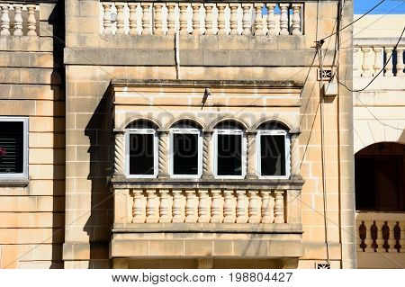 Traditional Maltese townhouse with a filled in balcony Bugibba Malta Europe.