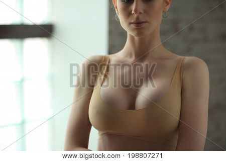 Slender Blonde Girl Ballerina In Bright Dancing Hall. Woman With Big Breast And In Beige Underwear S
