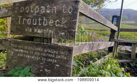 sign of the foothpath to the town of troutbeck