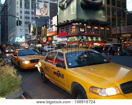 New York taxis at dusk. Nov 12th 2016. New York's cabs face uncertain future in wake of Uber and Lyft.