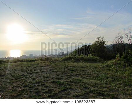 Beautiful sun sunset view from the mountain to the sea in Adler